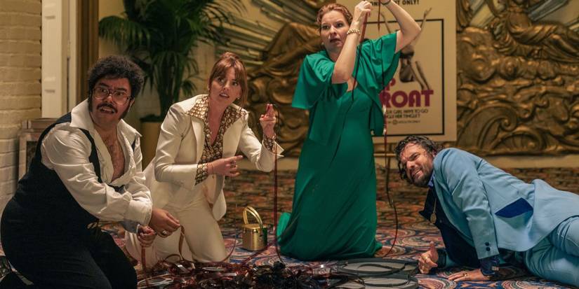 Oscar Montoya, Ophelia Lovibond, Lennon Parham and Jake Johnson look frantic with unrolled film in Minx.