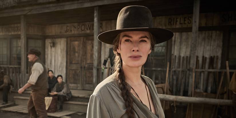 Lena Headey staring out in front of a storefront in The Abandons