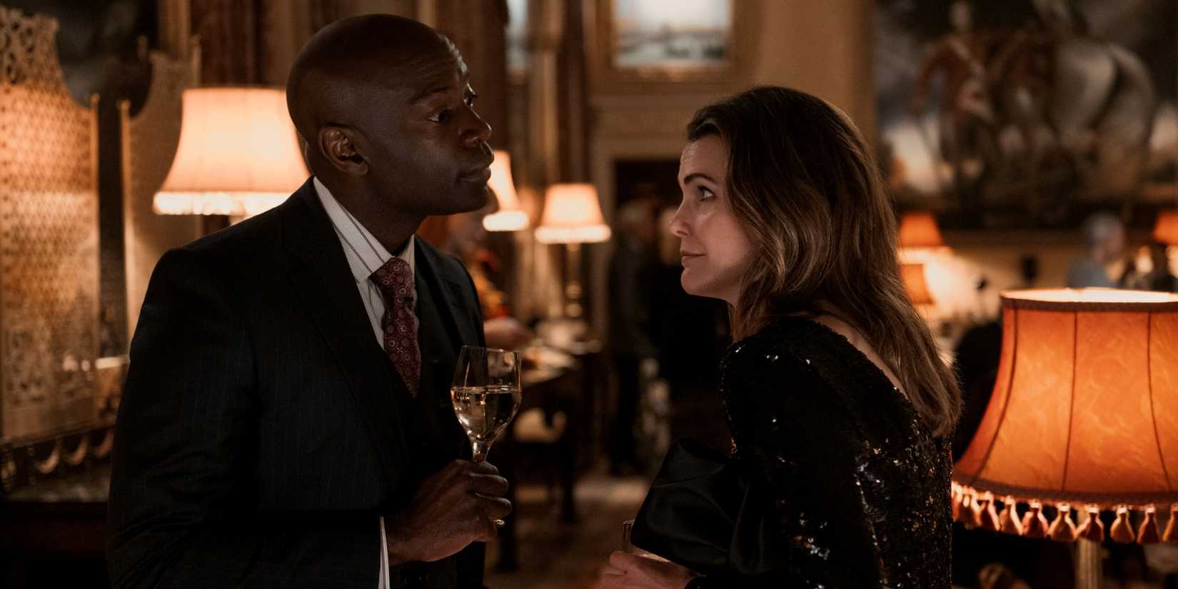 Kerri Russell as Kate Wyler with David Gyasi as Dennison standing across from each other in The Diplomat.