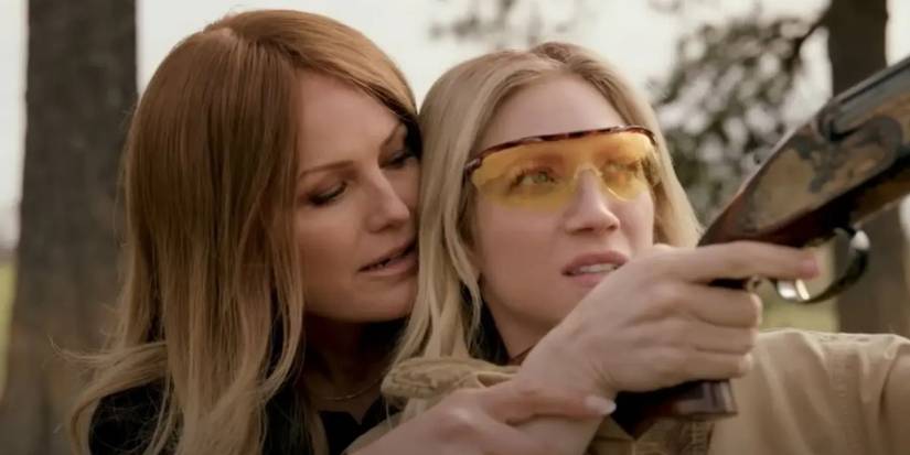 Malin Akerman as Margo teaches Brittany Snow as Sophie to fire a gun in the pilot of The Hunting Wives.