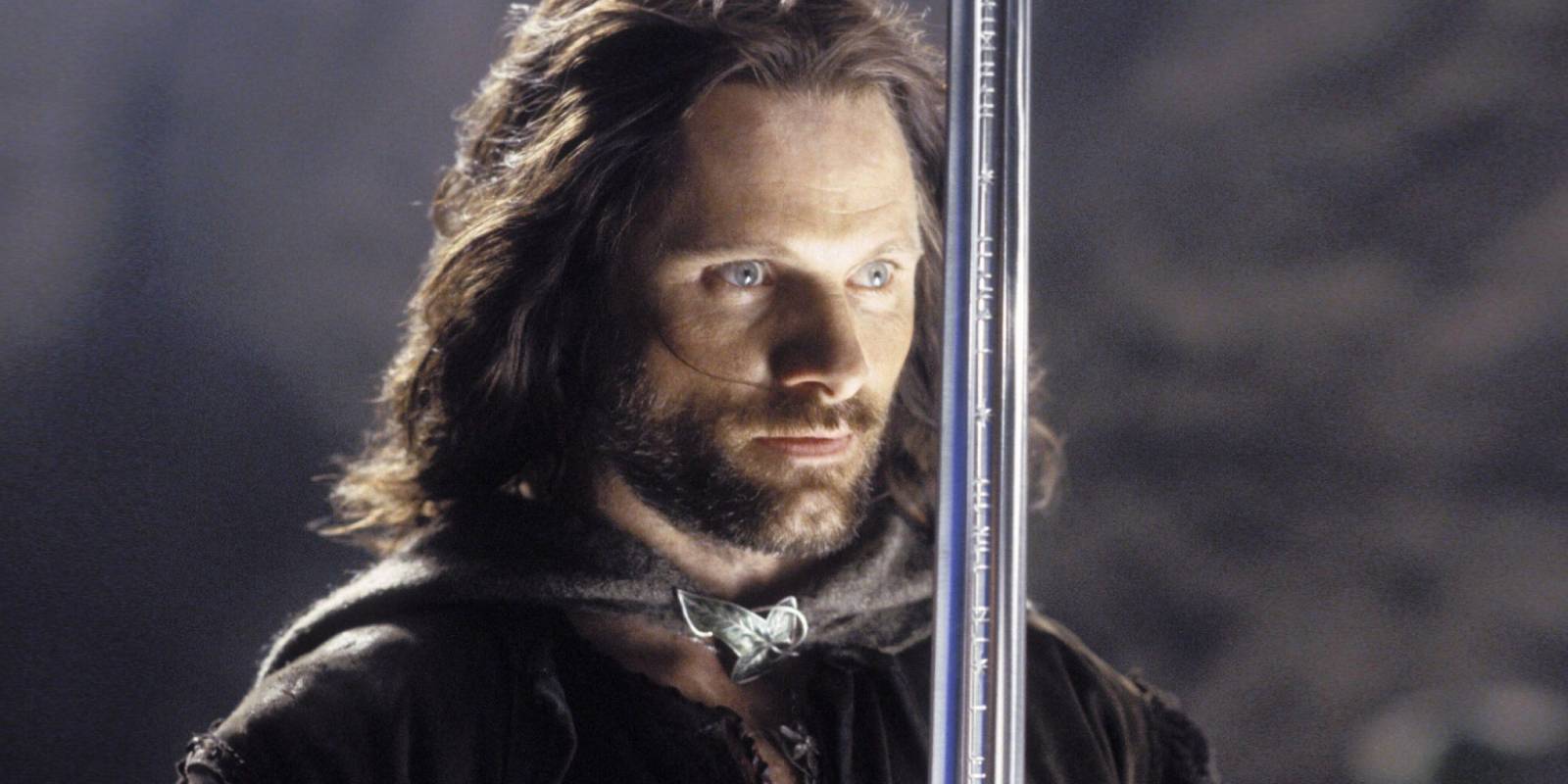 Viggo Mortensen holding a sword in The Lord of the Rings: The Return of the King 