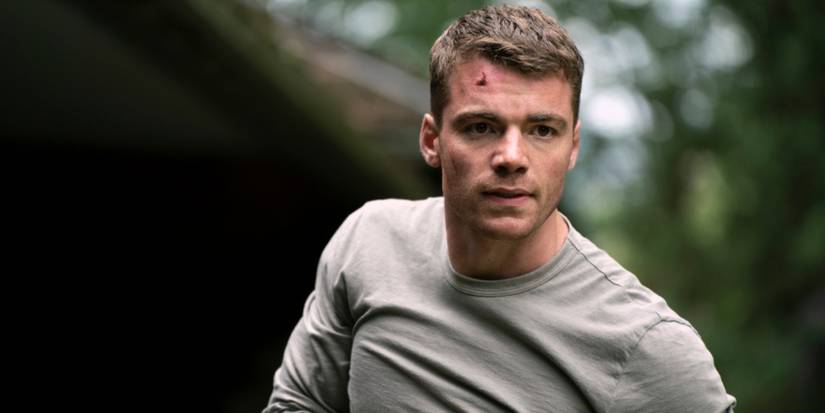 Gabriel Basso as Peter Sutherland outside looking tense in the pilot of 