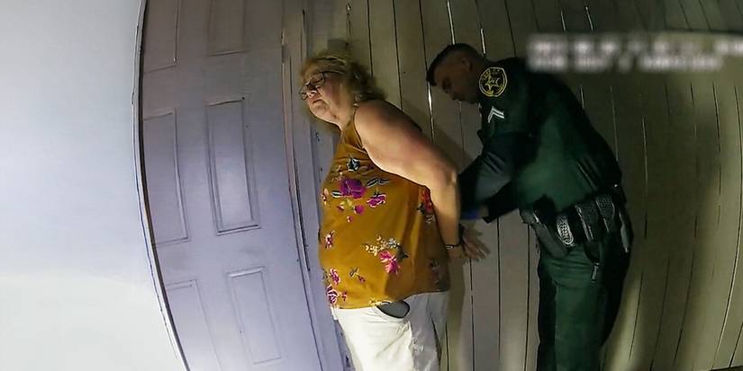 A cop arresting a woman in The Perfect Neighbor
