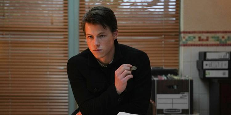 Milo Callaghan in the office in The Rainmaker