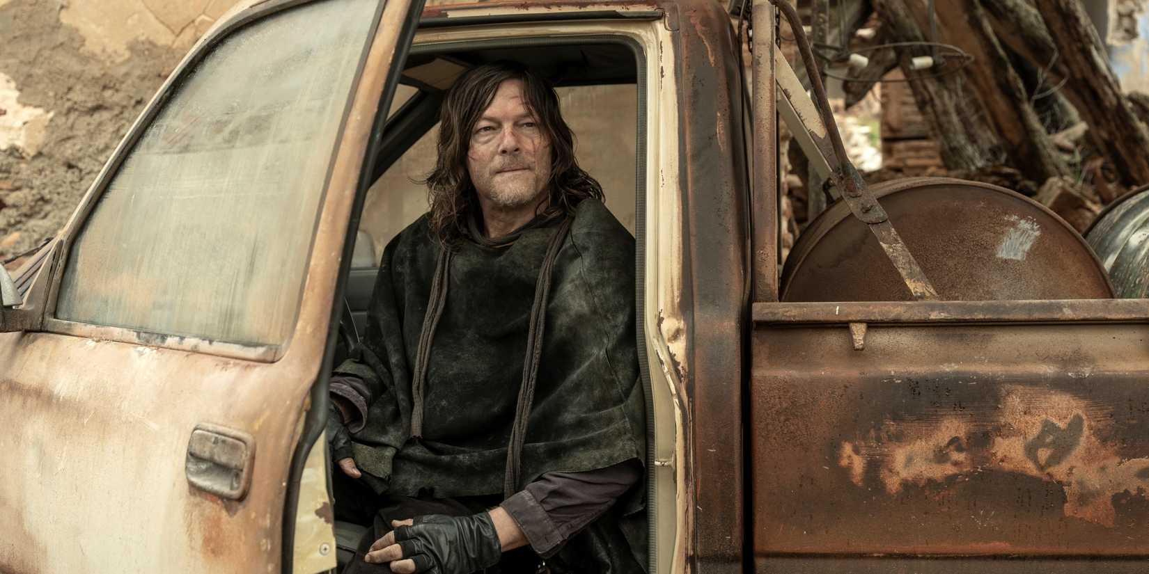 Norman Reedus as Daryl sitting inside a truck with the door open in The Walking Dead: Daryl Dixon