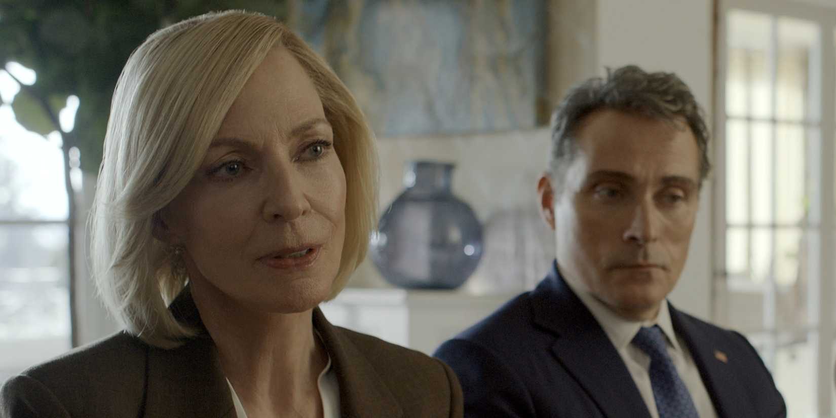 Allison Janney as President Grace Penn sitting next to Rufus Sewell as VP Hal Wyler in The Diplomat Season 3.