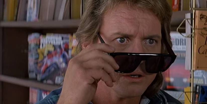 Roddy Piper as Nada removing sunglasses in They Live.