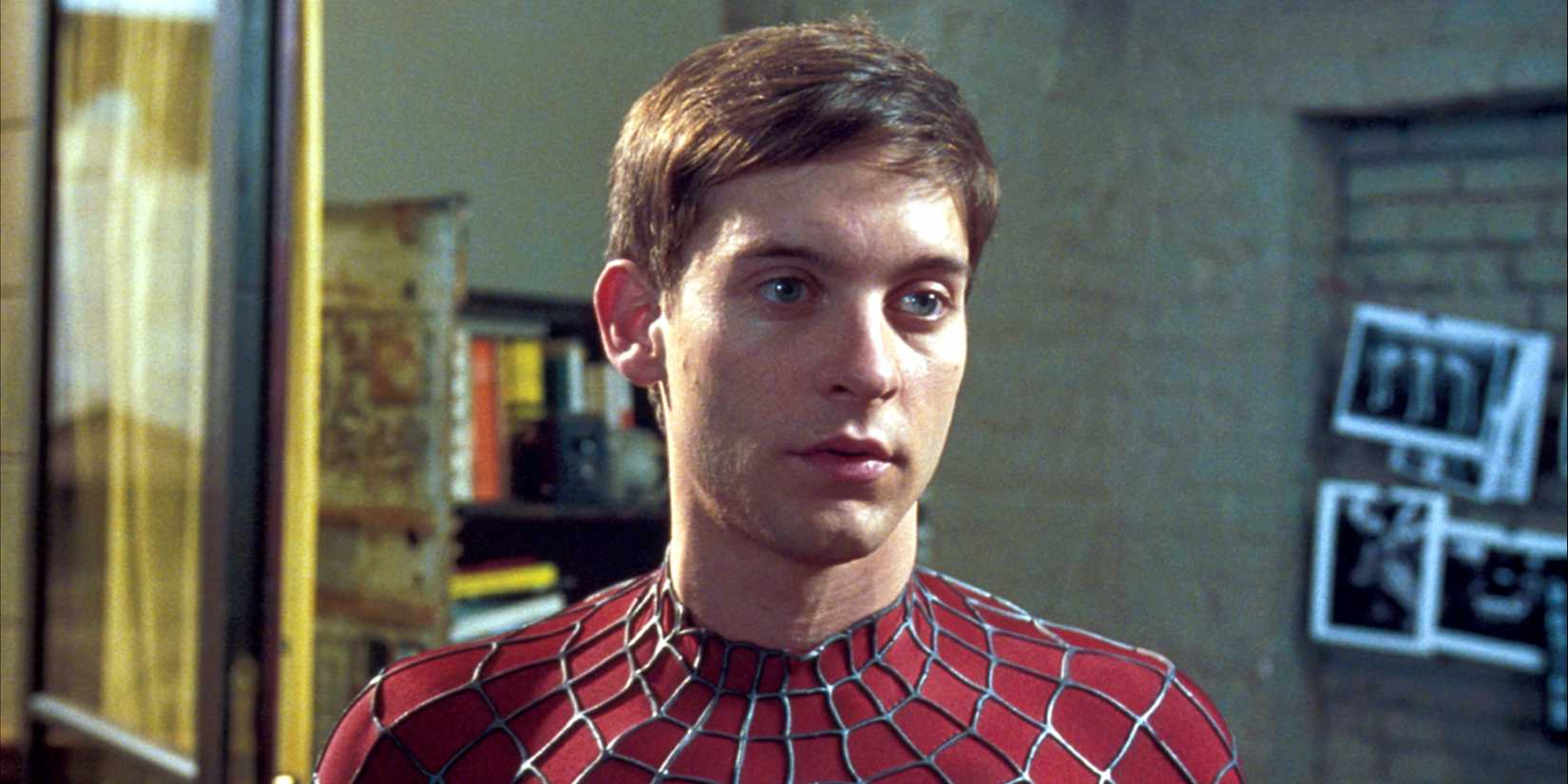 Tobey Maguire in the spidey suit staring ahead in Spider-Man, 2002. 