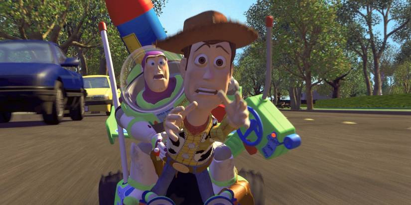Buzz and Woody racing down a street on a remote control car reaching out and looking stressed in Toy Story.