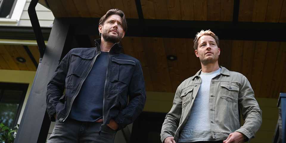 Justin Hartley and Jensen Ackles stand together on a front porch in Tracker Season 2, Episode 1