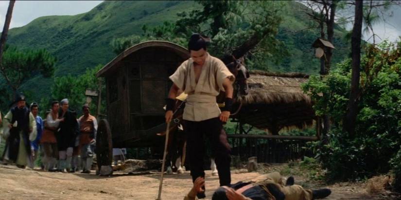 A man stands over another man after a fight in Brothers Five.