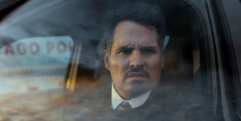 Detective Alcaras in his car looking upset in All Her Fault.