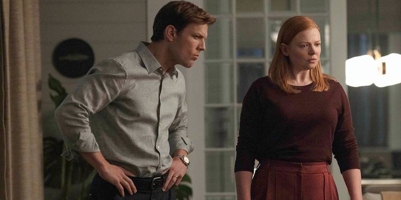 Jake Lacy and Sarah Snook looking shocked in All Her Fault