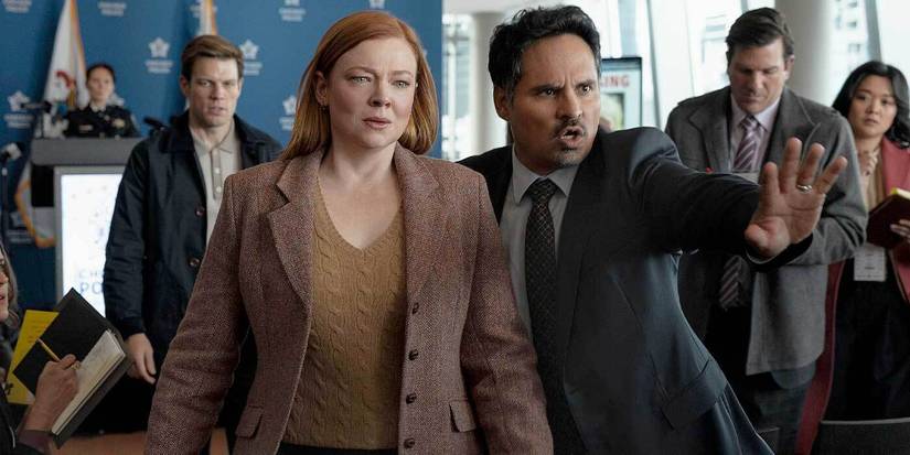 Sarah Snook and Michael Peña make their way through a crowd in All Her Fault.