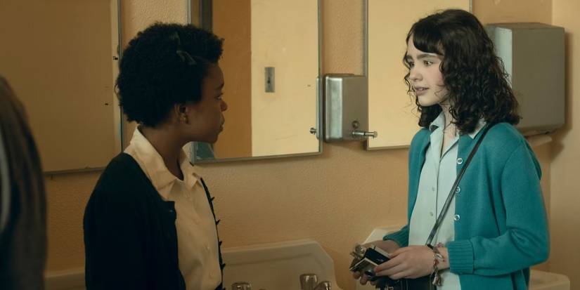 Ronnie (Amanda Christine) and Lilly (Clara Stack) talk in the bathroom in 'IT: Welcome to Derry'