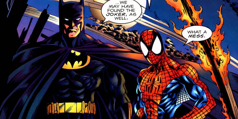 Batman and Spider-Man standing in flaming wreckage together in Marvel Comics