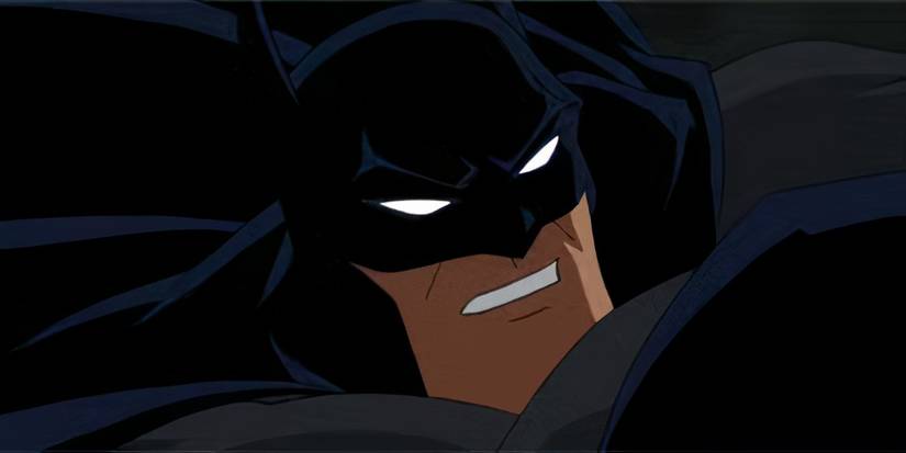 Batman grimacing mid-punch in Batman: Under the Red Hood