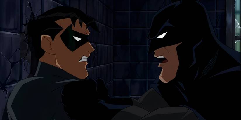 Batman pinning Jason Todd to a wall in Batman: Under the Red Hood