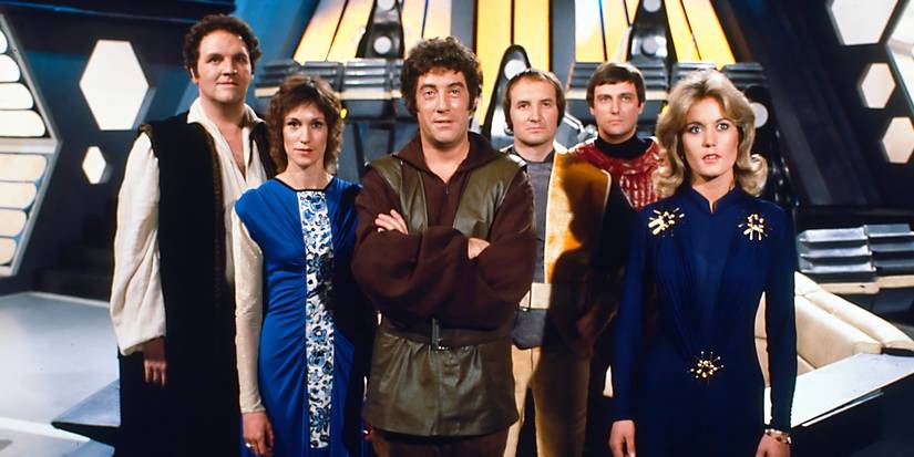 The original cast of Blake's 7 standing on the bridge of the Liberator