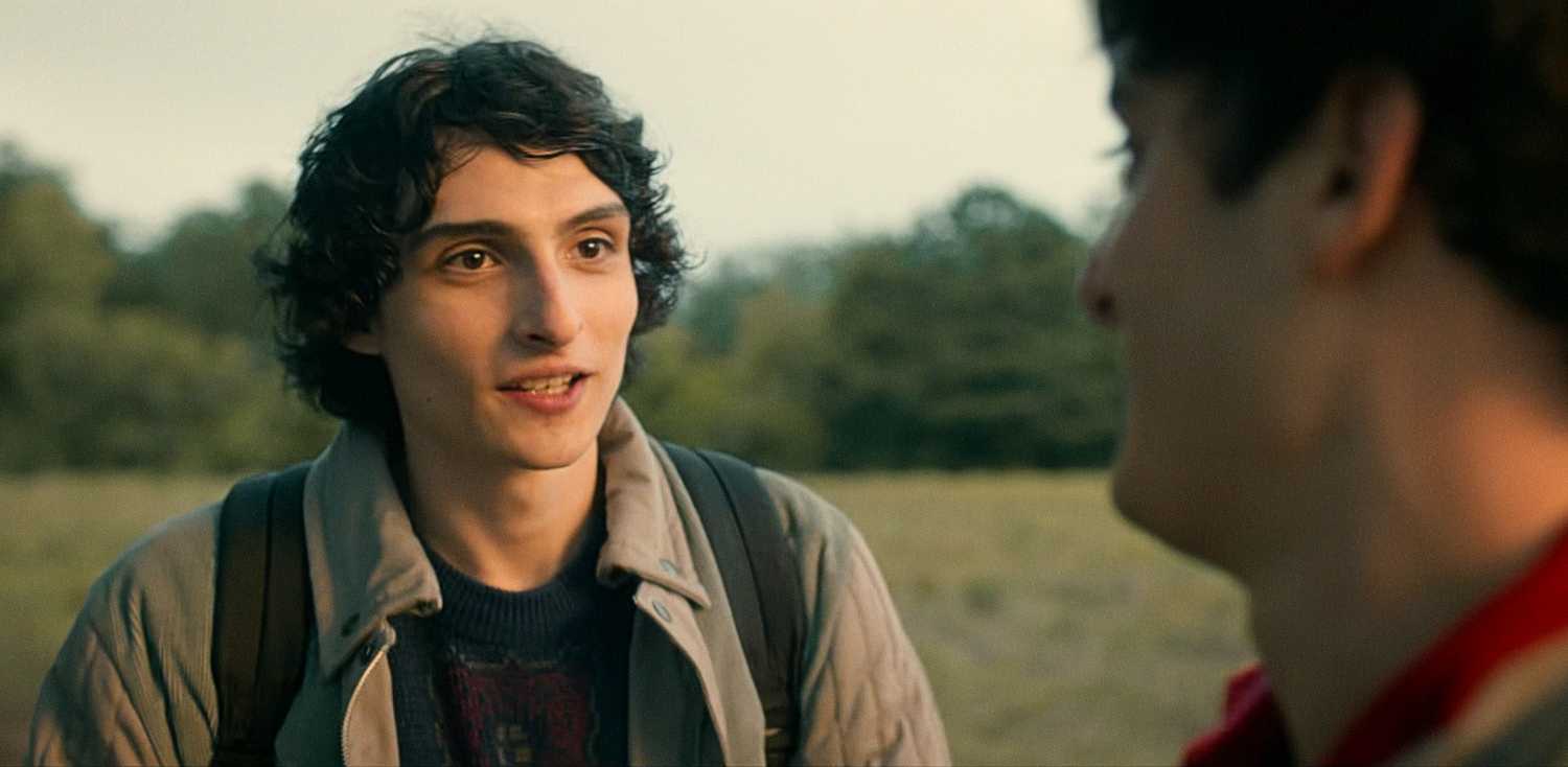 Mike Wheeler smiling while talking to Will in Stranger Things Season 5