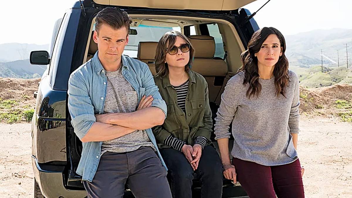 A promo photo for Casual Season 4: Alex Cole standing with Valerie and Laura Meyers in front of the open back of a van
