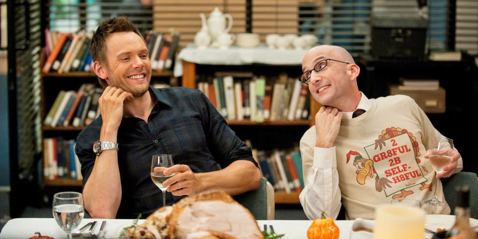 Dean Pelton copying Jeff as they enjoy a Thanksgiving dinner in Community.