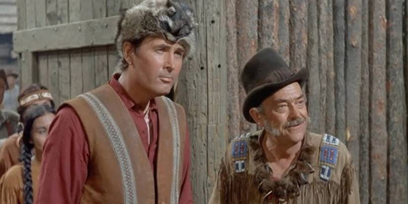 Daniel Boone (Fess Parker) stands beside his father-in-law Timothy Patrick Bryan (John McIntire) in the 'Daniel Boone' episode "The Thanksgiving Story"