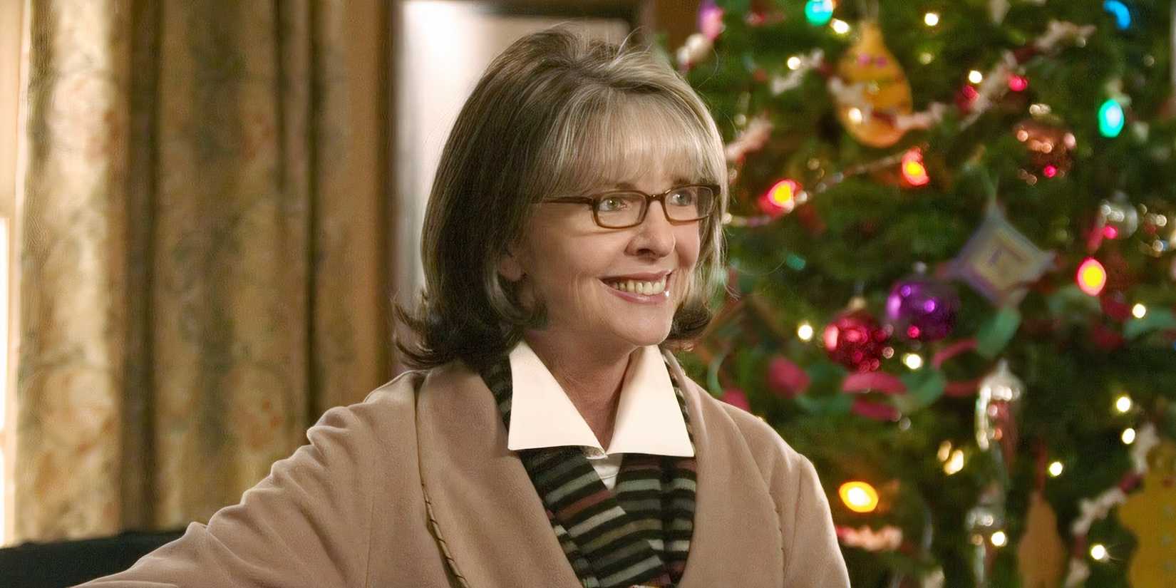 Diane Keaton as Sybil Stone smiling with a Christmas tree in the background in The Family Stone.