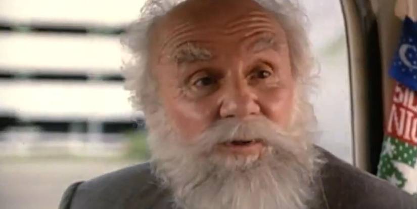 Douglas Seale as Santa talking to someone in a car who is off-screen in Ernest Saves Christmas.