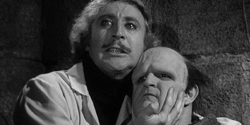 Dr. Frederick Frankenstein (Gene Wilder) holds his monster (Peter Boyle) close in Young Frankenstein.