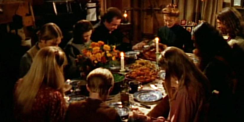 The cast of 'Dr. Quinn, Medicine Woman' with Johnny Cash and June Carter Cash enjoying a holiday meal in the first "Thanksgiving" episode.