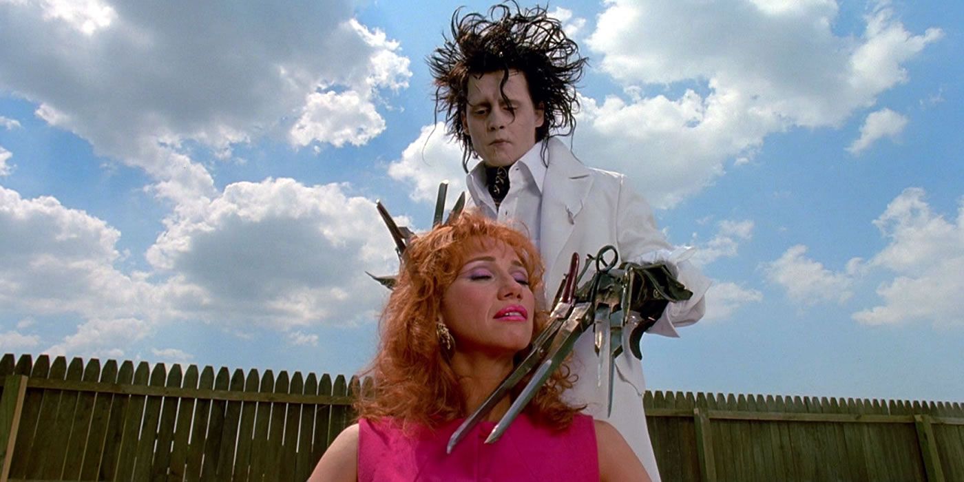 edward-scissorhands-cutting-hair Tim Burton's Sci-Fi Fantasy Masterpiece Is Officially a Halloween Streaming Hit