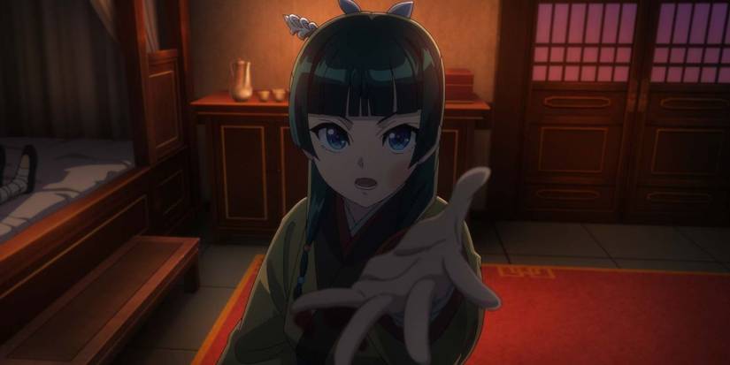 Maomao reaching towards the screen in The Apothecary Diaries