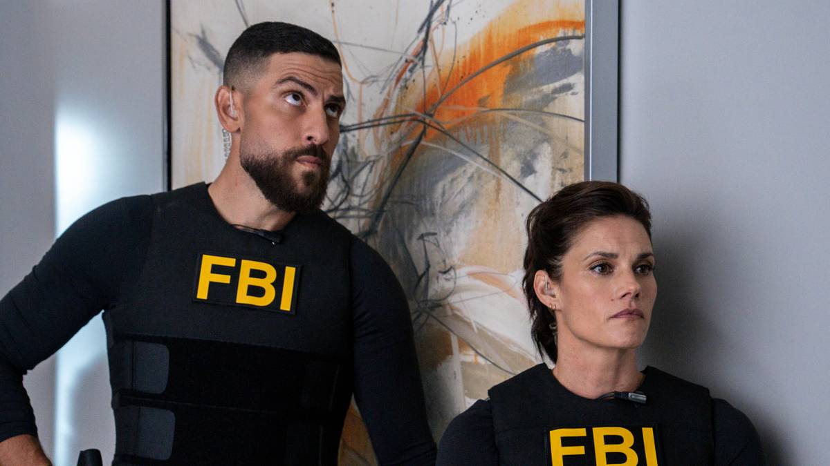 Zeeko Zaki and Missy Peregrym moving in against a painting in FBI Season 8