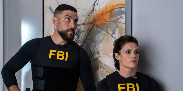 Zeeko Zaki and Missy Peregrym moving in against a painting in FBI Season 8