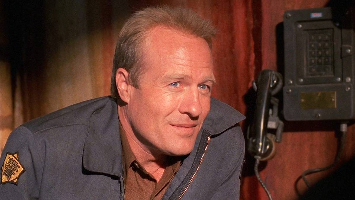 Man in a uniform smiling