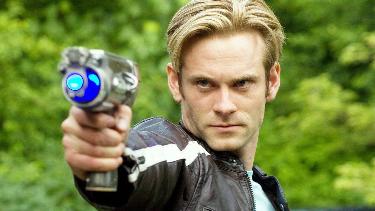 Eric Johnson staring ahead and pointing a laser in Flash Gordon