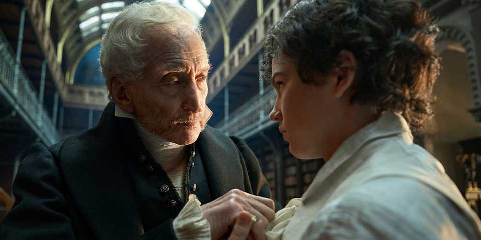 Charles Dance as Leopold Frankenstein beside his young son Victor (Christian Convery) in 'Frankenstein' (2025)