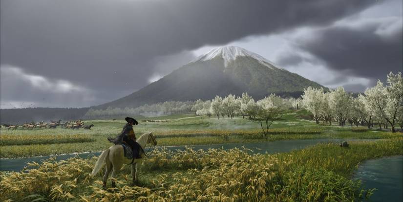ghost-of-yotei, person on a horse in front of Mount Fuji