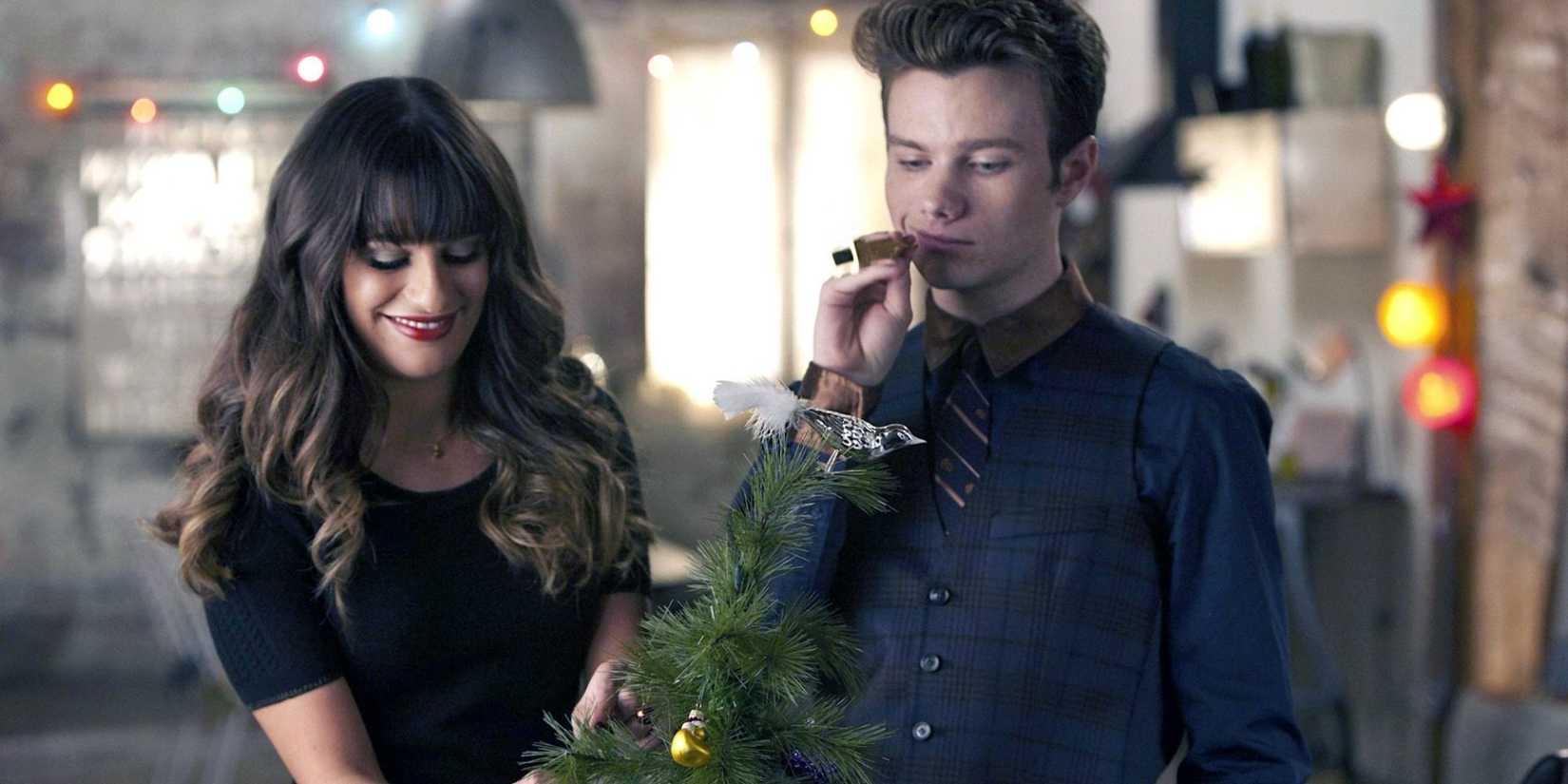 Two people look at a small Christmas tree in Glee episode Glee, Actually.