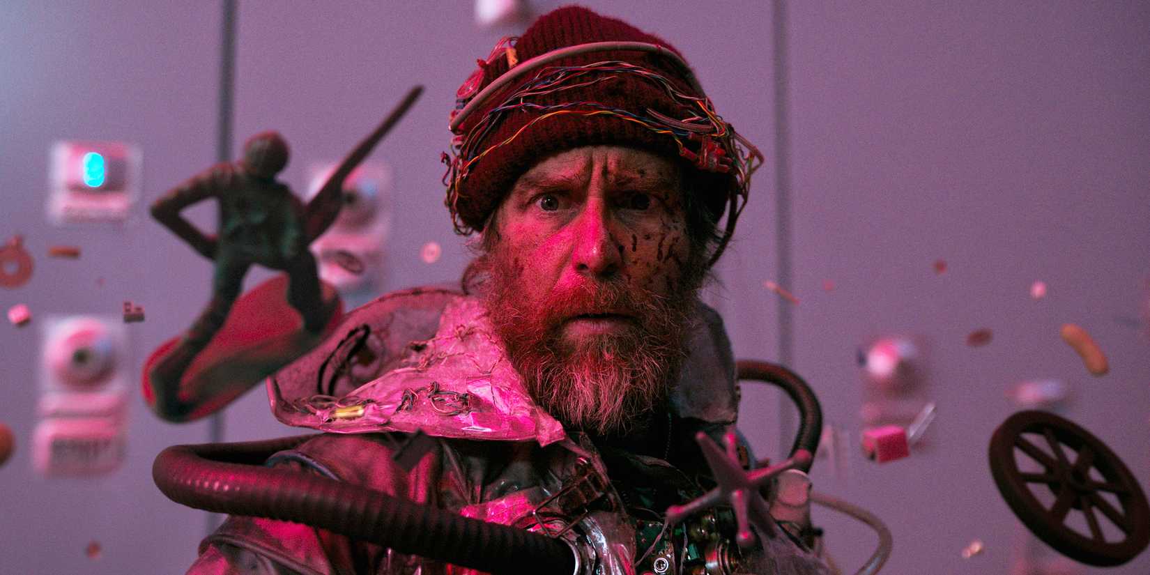 Sam Rockwell in Good Luck, Have Fun, Don't Die looking at floating objects 