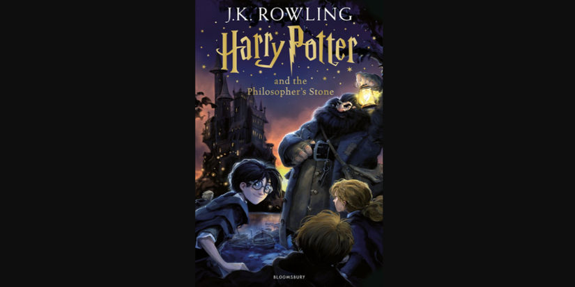Harry and Hagrid with Hogwarts behind on cover of Harry Potter and the Philosopher's Stone by J.K. Rowling. 