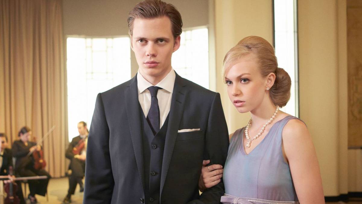 Letha holding on to Roman's arm