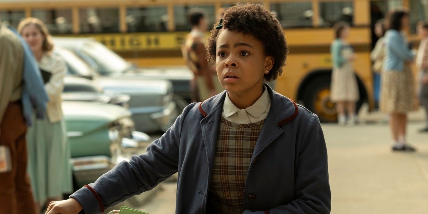 Amanda Christine as Ronnie looking concerned while walking with her bike in IT: Welcome to Derry.