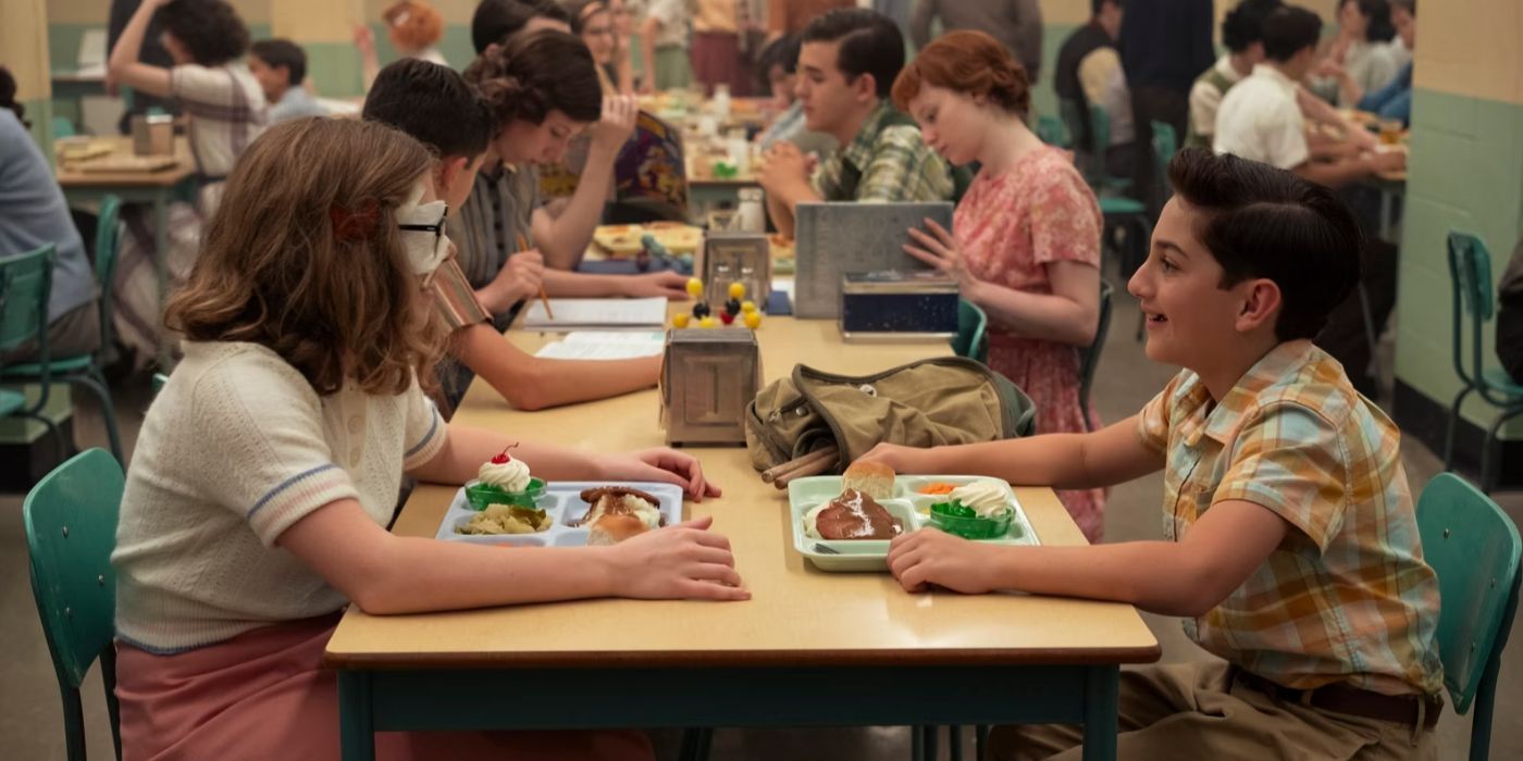 Marge (Matilda Lawler) and Rich (Arian S. Cartaya) eat lunch together in 'IT: Welcome to Derry'