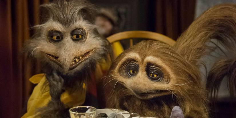 Two creatures sitting at a table in 'Jim Henson's Turkey Hollow'