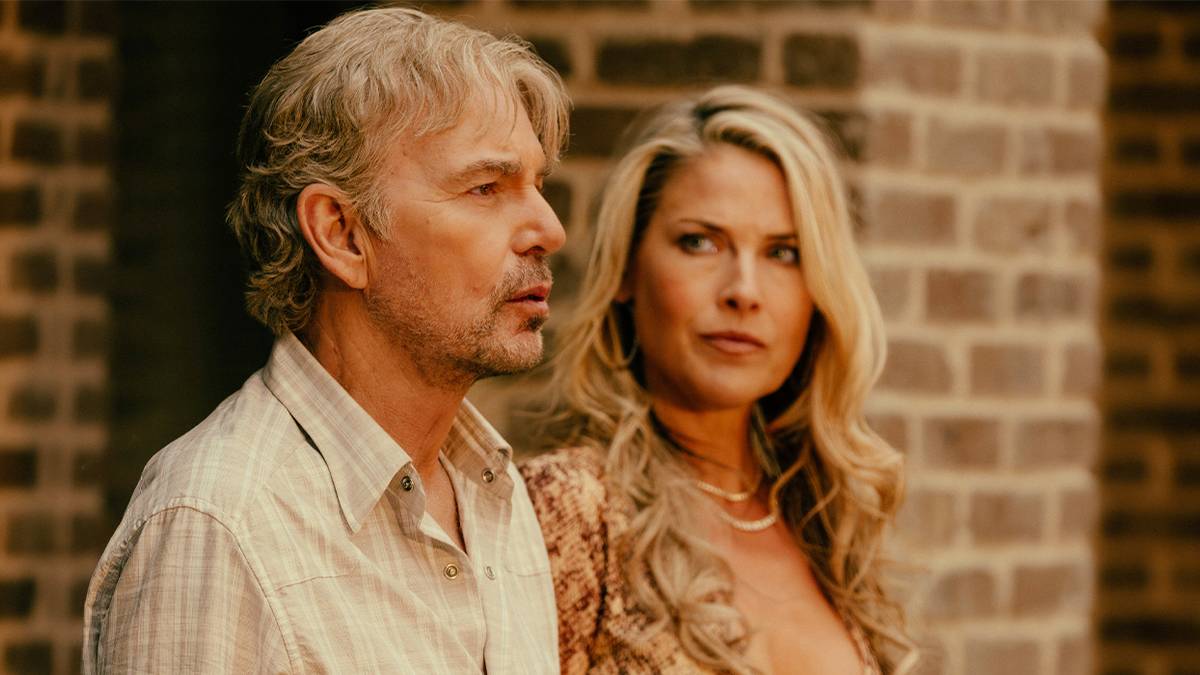 Angela Norris looking at her husband Tommy Norris with concern in Landman Season 2.