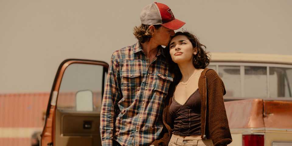 Jacob Lofland kissing Paulina Chavez's head outside their truck in Landman Season 2 Episode 1