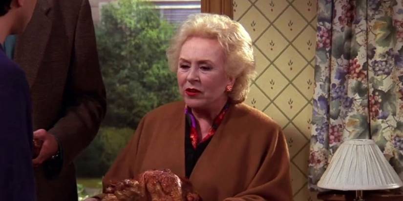 Doris Roberts as Marie Barone holding a turkey on Everybody Loves Raymond.