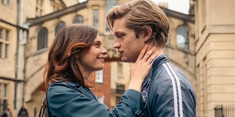 Ruby with her hair down and her hand on James' neck as she smiles at him in Maxton Hall.